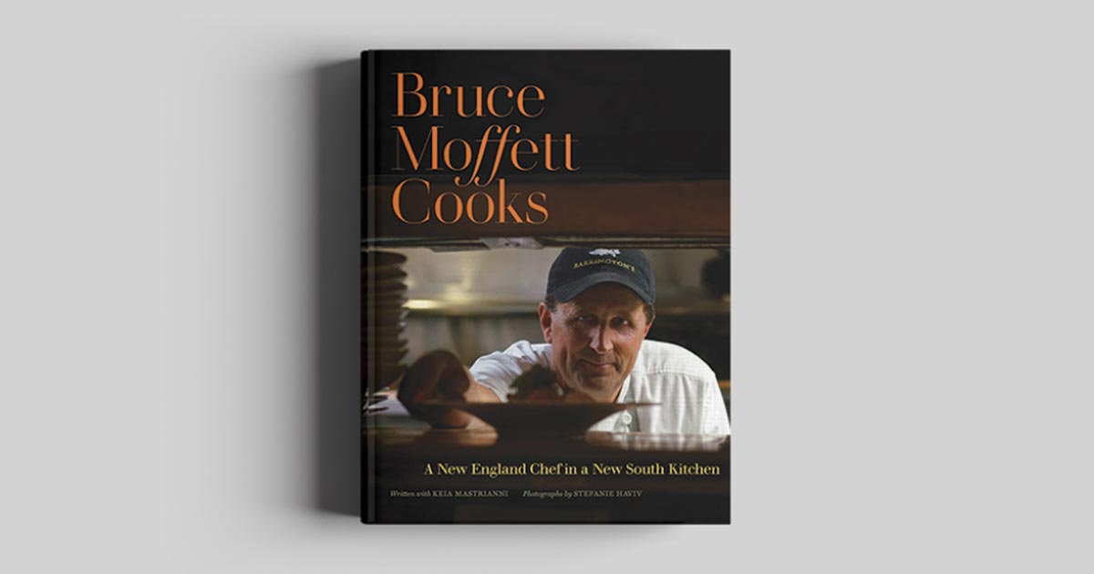 cookbook with close-up of chef bruce moffett placing dish in order window