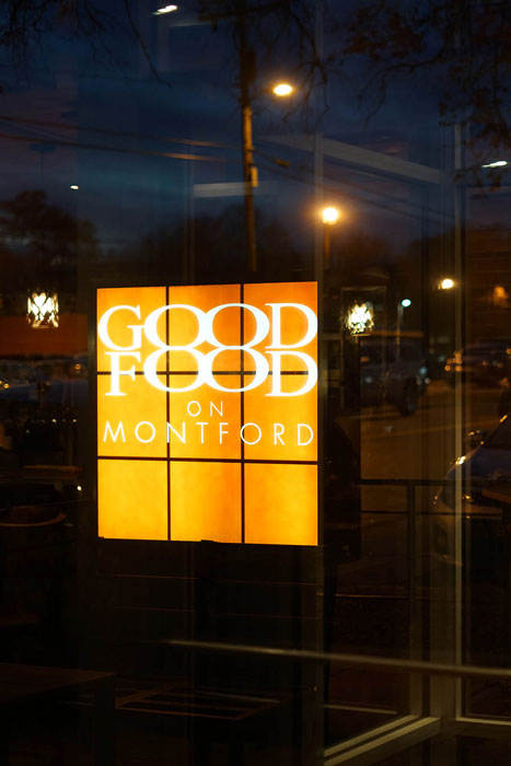 orange lightbox restaurant sign that says good food on montford